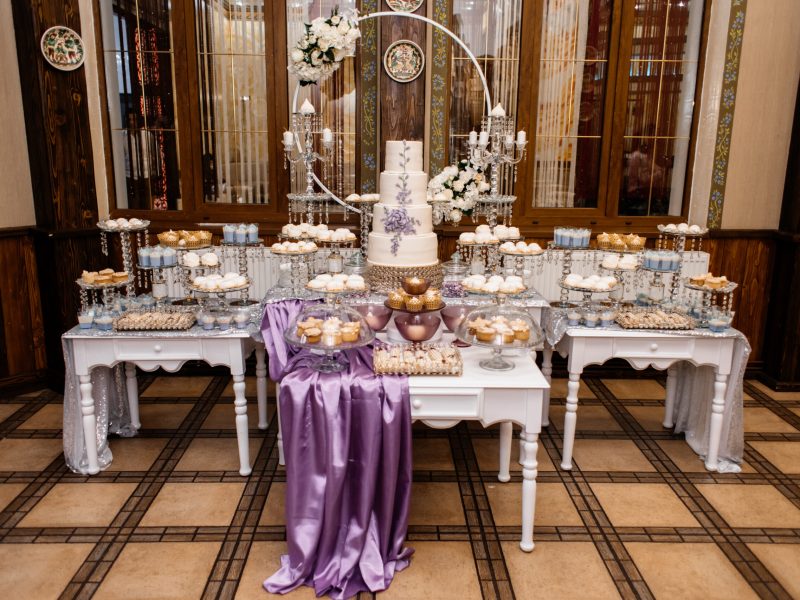 Pompous wedding candy bar and decorated with lavender wedding cake