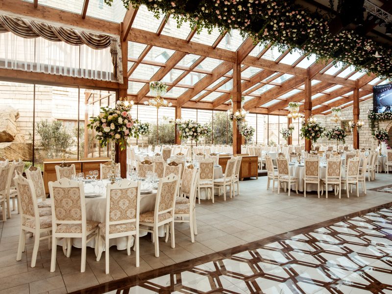 restaurant hall ornated with flowers restaurant hall ornated with flowers