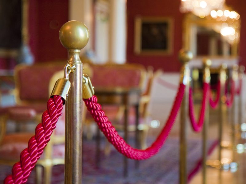 Detail of red rope on a exhibition space - defocused background concept image